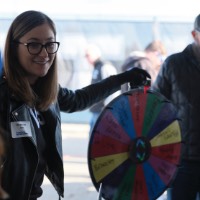 Shannon Dale pointing to spin wheel